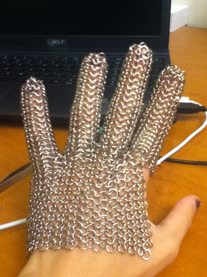 Yvonne's hand in a chainmail glove