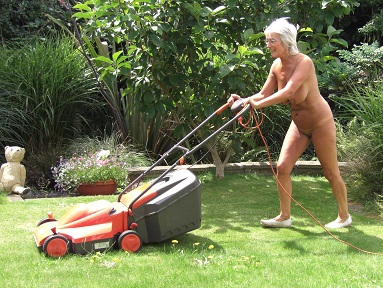 Yvonne, standing naked on a terrace looking out to the Ocean